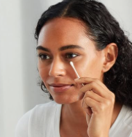 Woman using cotton swab